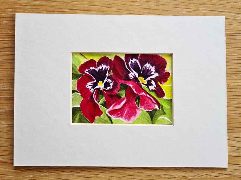 An example of an artist trading card with a mount ready for framing